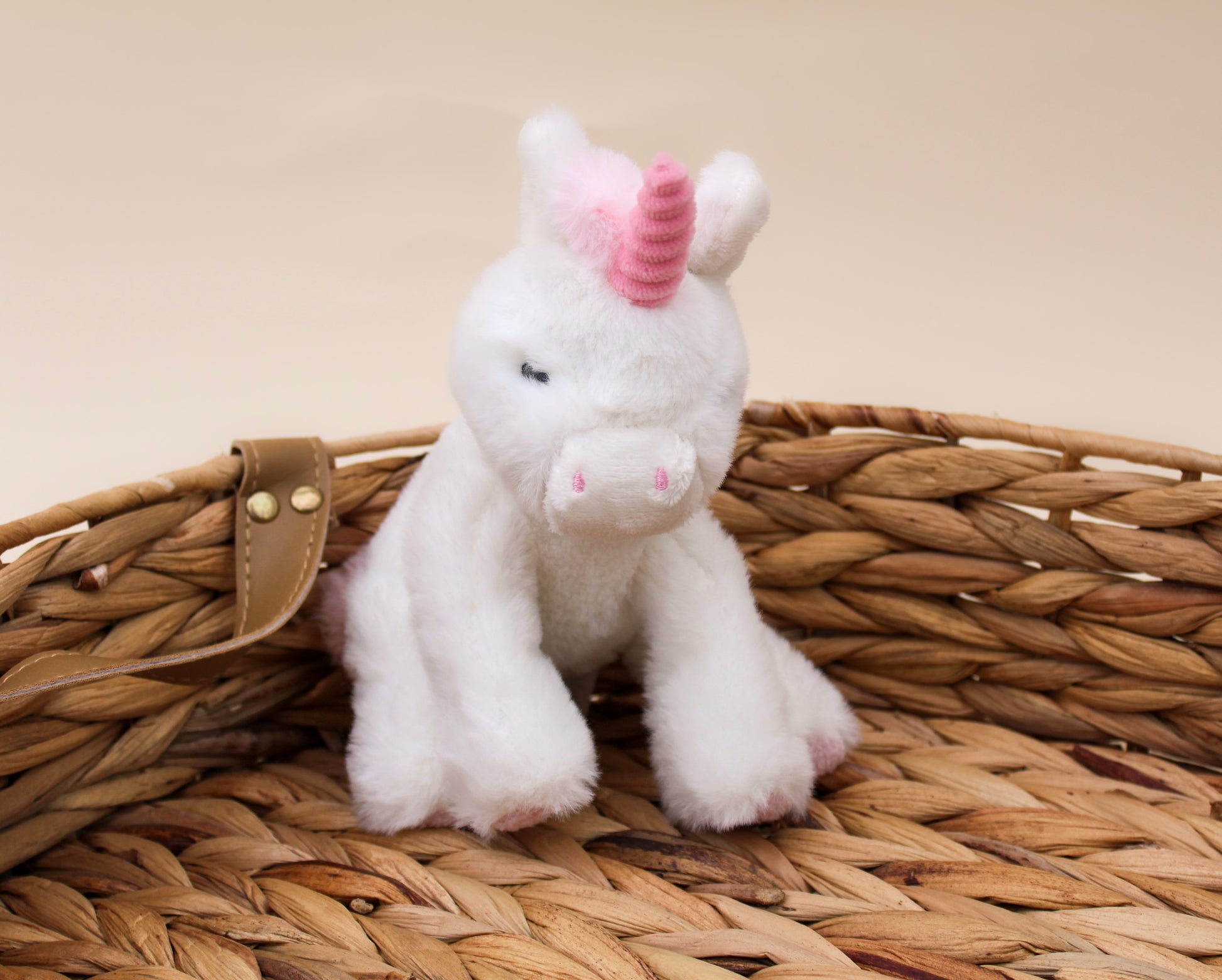 pink and white baby soft toy