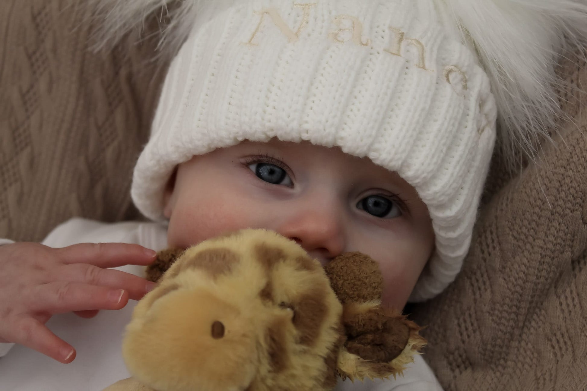 cute baby hat and baby giraffe toy