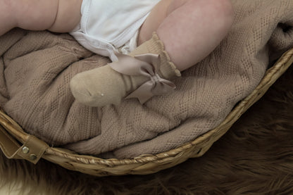 Brown cable knit baby blanket and taupe bow baby socks