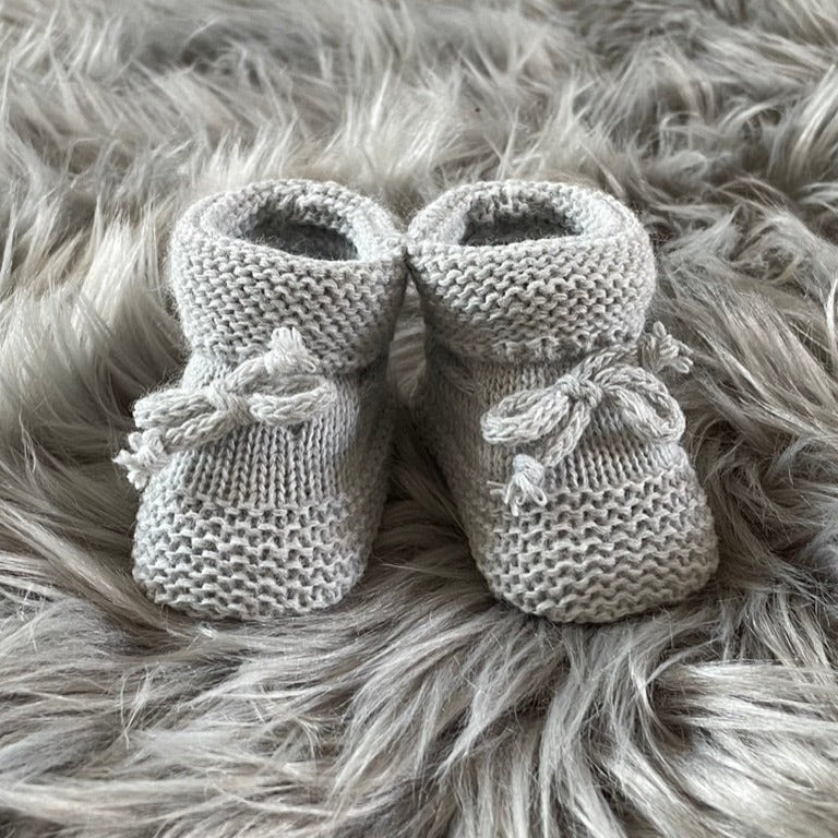 Grey knitted baby booties