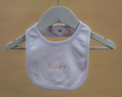 white embroidered baby bib