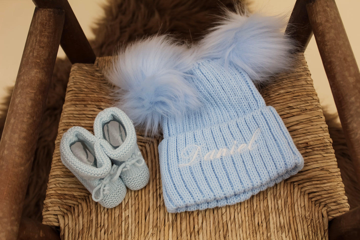 Embroidered baby blue knitted hat with matching booties