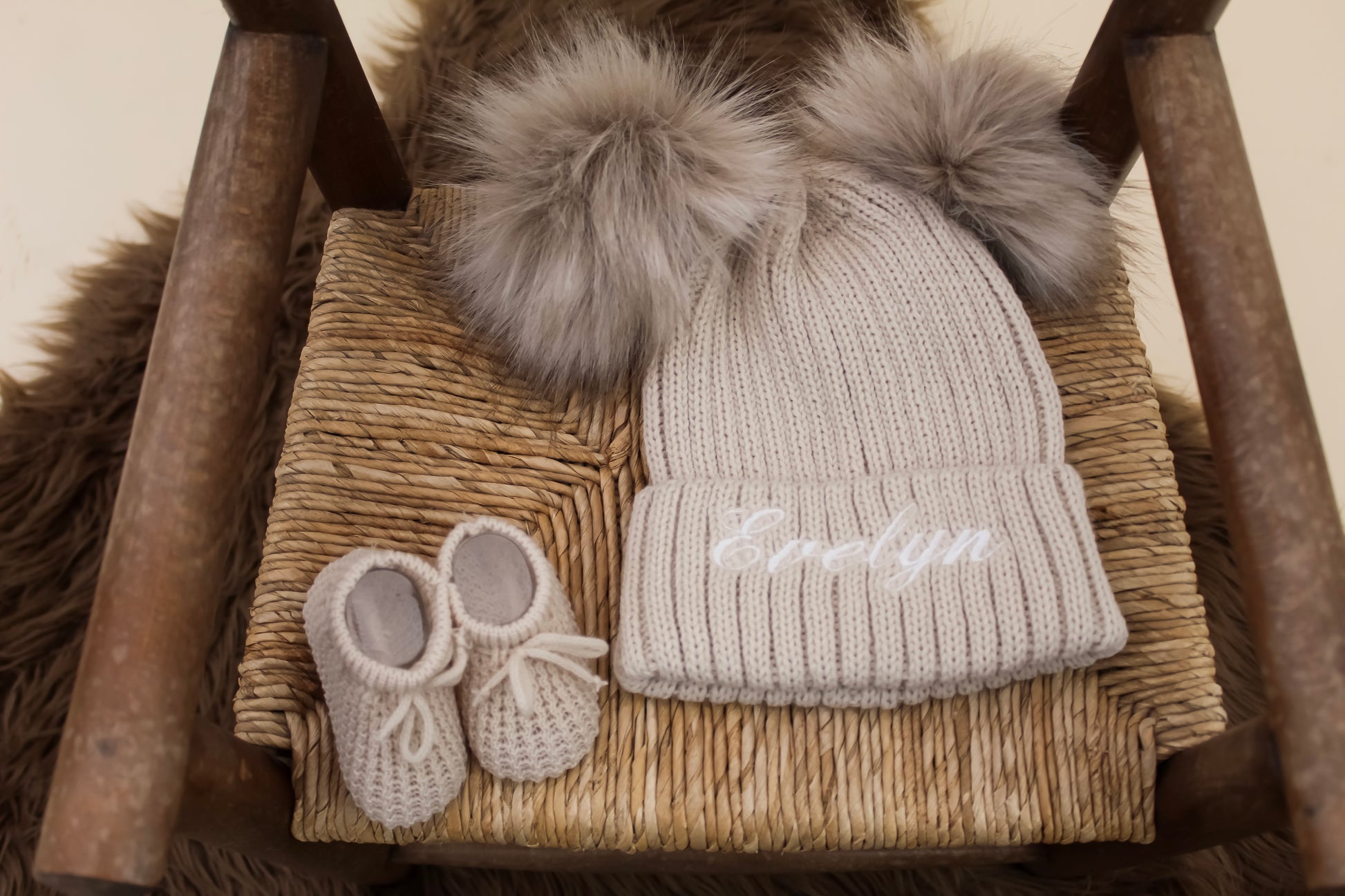 Sandy cream double pom pom knitted winter baby hat with matching knitted cream baby booties