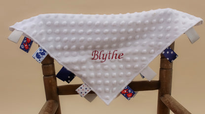 Embroidered white baby taggie comforter