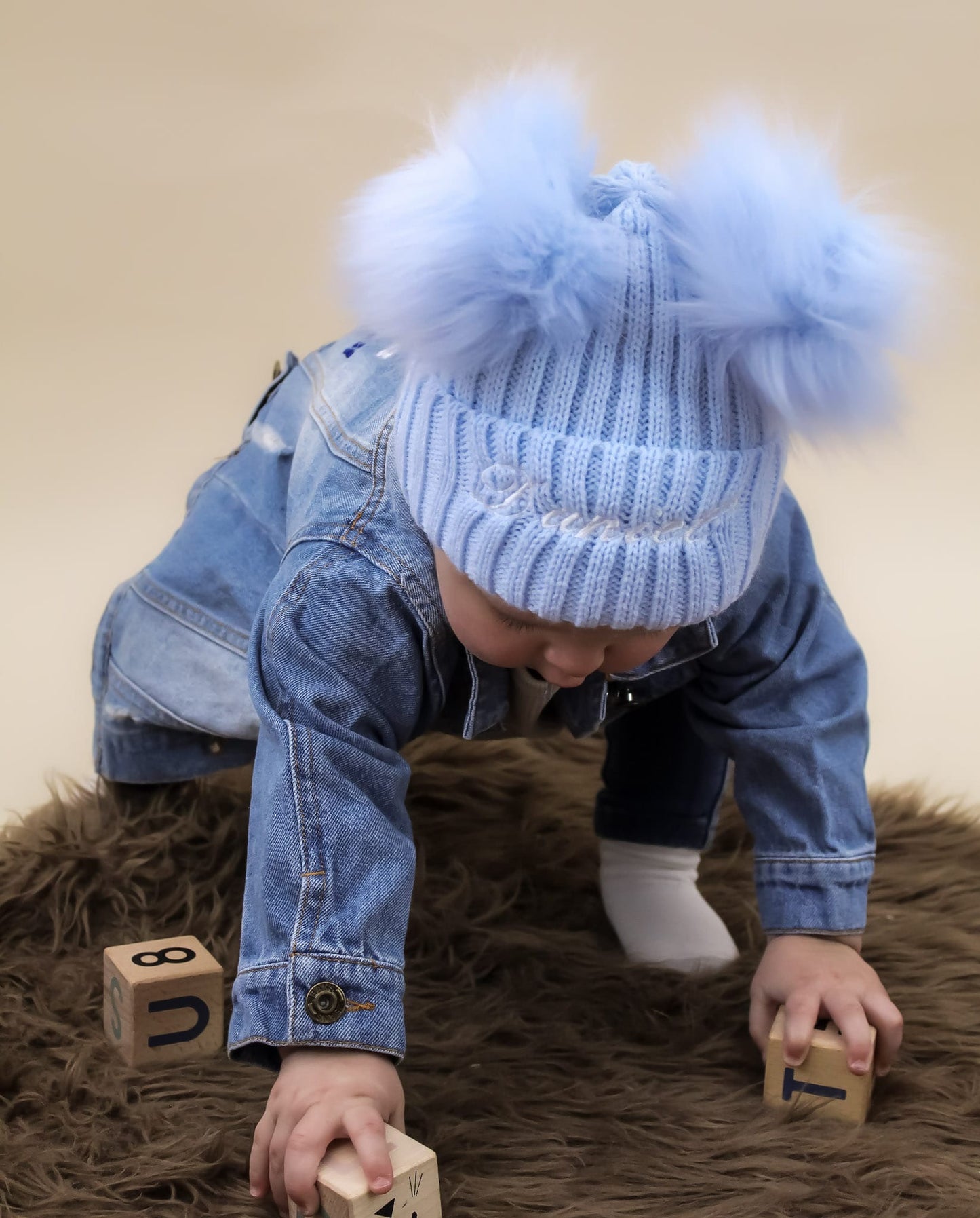 Baby blue double pom pom knitted winter hat